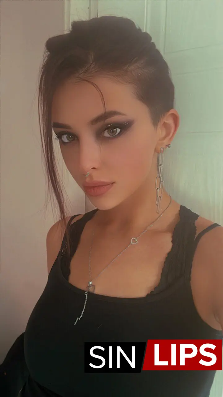 adjika escort wearing black top selfie photo and nose piercing